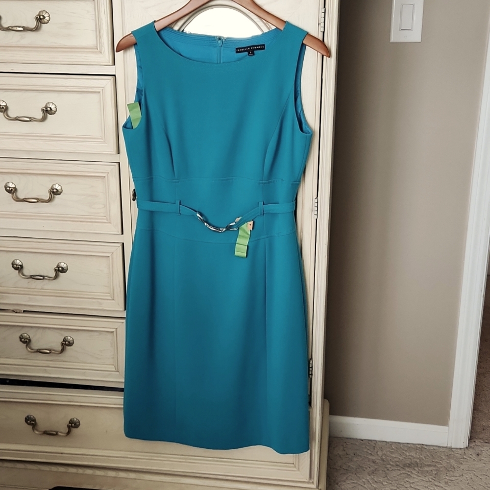 Flattering crepe, fully lined dress with belted detail.